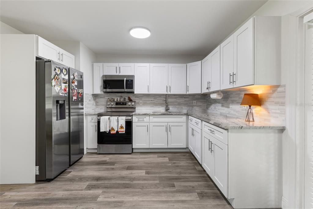 Interior, Kitchen, Recessed Lighting, Stainless Steel Appliances, Wood Texture Flooring