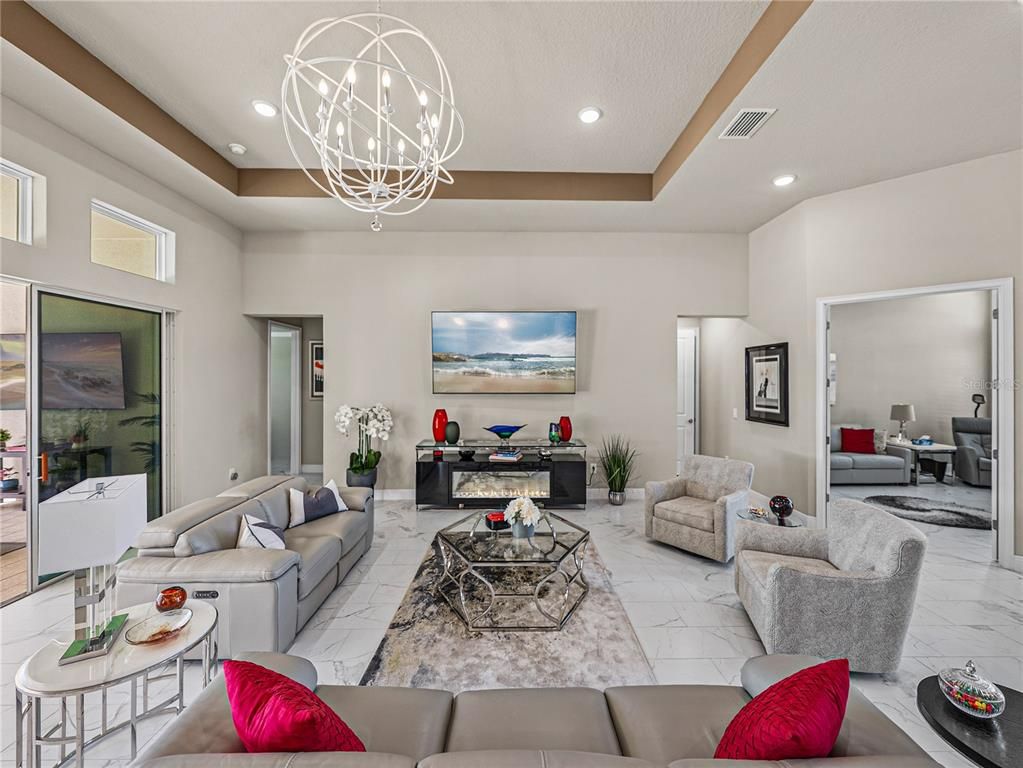 Chandelier, Fireplace, Interior, Living room, Marble, Recessed Lighting