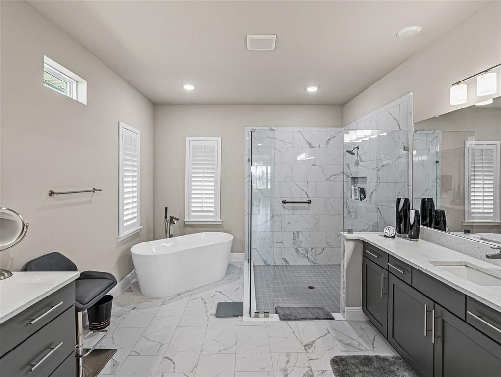 Bathroom, Dual Sink Vanities, Free Standing Baths, Glass Shower, Interior, Marble, Marble Walls, Recessed Lighting