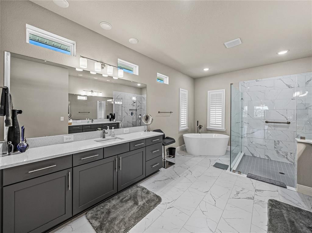 Bathroom, Dual Sink Vanities, Free Standing Baths, Glass Shower, Interior, Marble, Marble Walls, Recessed Lighting