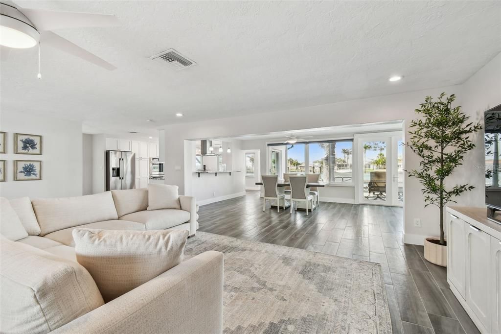 Dining room, Interior, Kitchen, Living room, Recessed Lighting, Stainless Steel Appliances, Wood Texture Flooring