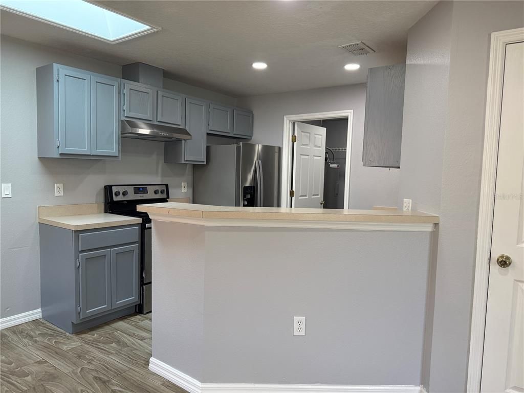 Interior, Kitchen, Recessed Lighting, Stainless Steel Appliances, Wood Texture Flooring