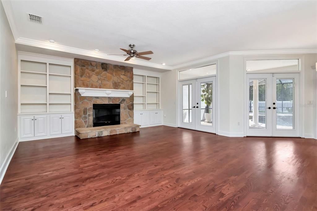 Empty room, Fireplace, Interior, Recessed Lighting, Stone Walls, Wood Texture Flooring