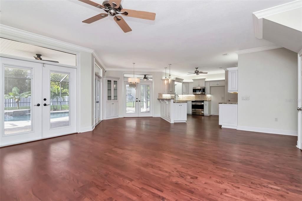 Empty room, Interior, Kitchen, Pendant Lights, Stainless Steel Appliances, Wood Texture Flooring