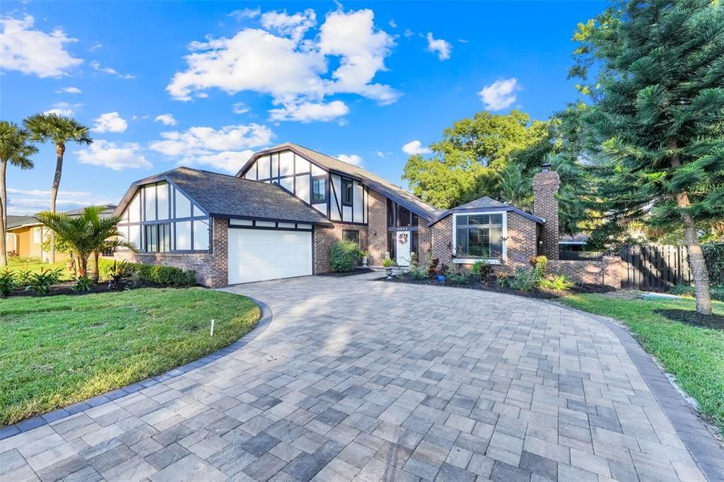 Attached, Backyard, Exterior, Facade, Brick Facade, Tudor Revival