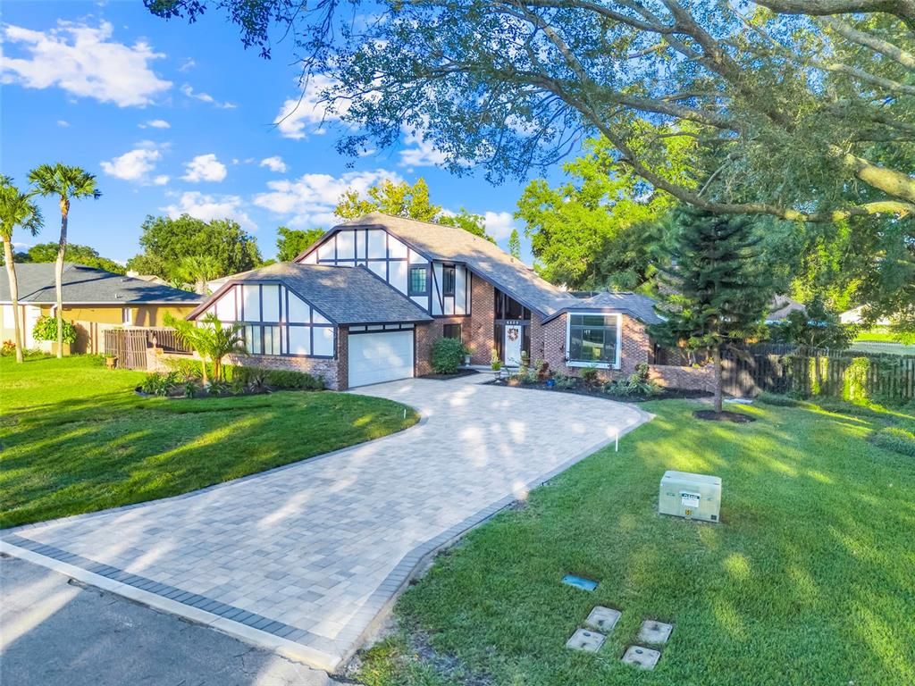 Attached, Backyard, Exterior, Facade, Brick Facade, Tudor Revival