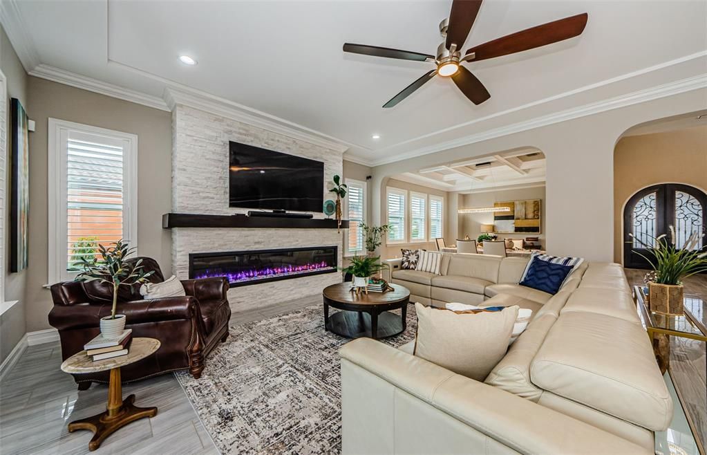 Fireplace, Interior, Living room, Recessed Lighting, Stone Walls, Wood Texture Flooring