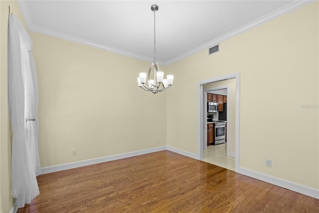 Chandelier, Empty room, Interior, Kitchen, Pendant Lights, Stainless Steel Appliances, Wood Texture Flooring