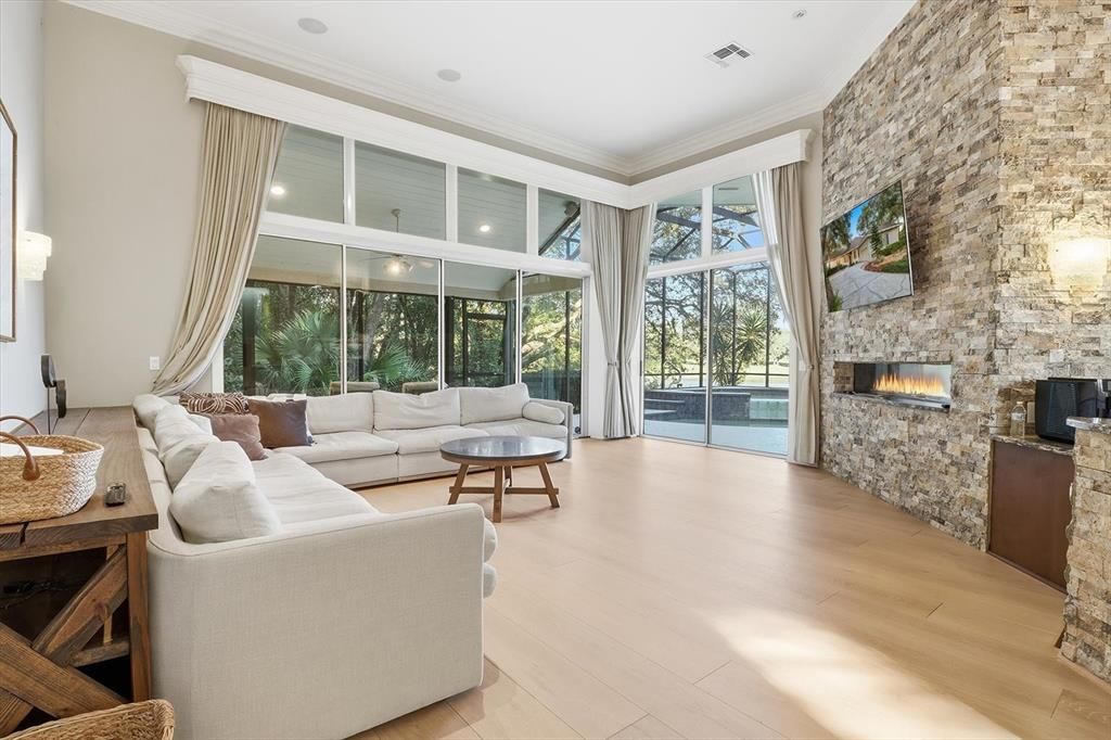 Fireplace, Interior, Living room, Recessed Lighting, Stone Walls, Wood Texture Flooring