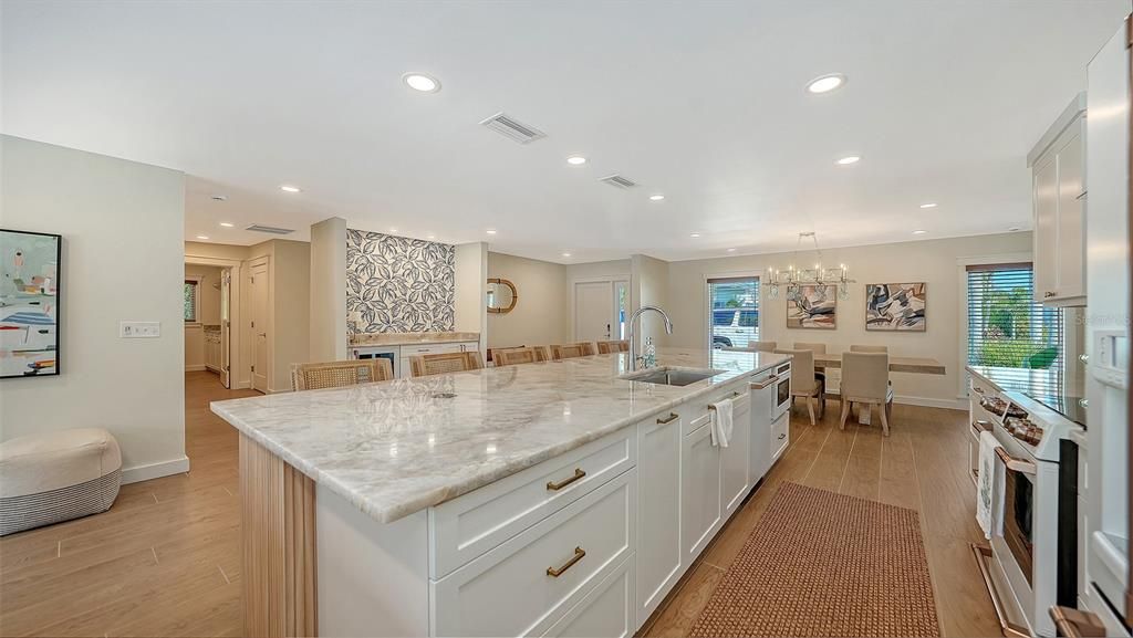 Chandelier, Dining room, Interior, Kitchen, Recessed Lighting, Stainless Steel Appliances, Wood Texture Flooring
