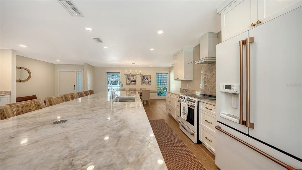 Chandelier, Dining room, Interior, Kitchen, Recessed Lighting, Stainless Steel Appliances, Wood Texture Flooring