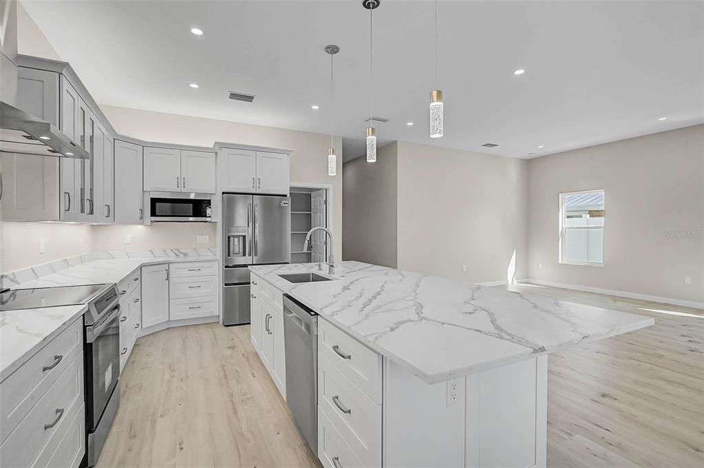 Interior, Kitchen, Pendant Lights, Recessed Lighting, Stainless Steel Appliances, Wood Texture Flooring