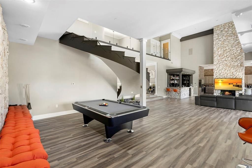 Billiard Table, Fireplace, Game Room, Interior, Recessed Lighting, Stone Walls, Wood Texture Flooring