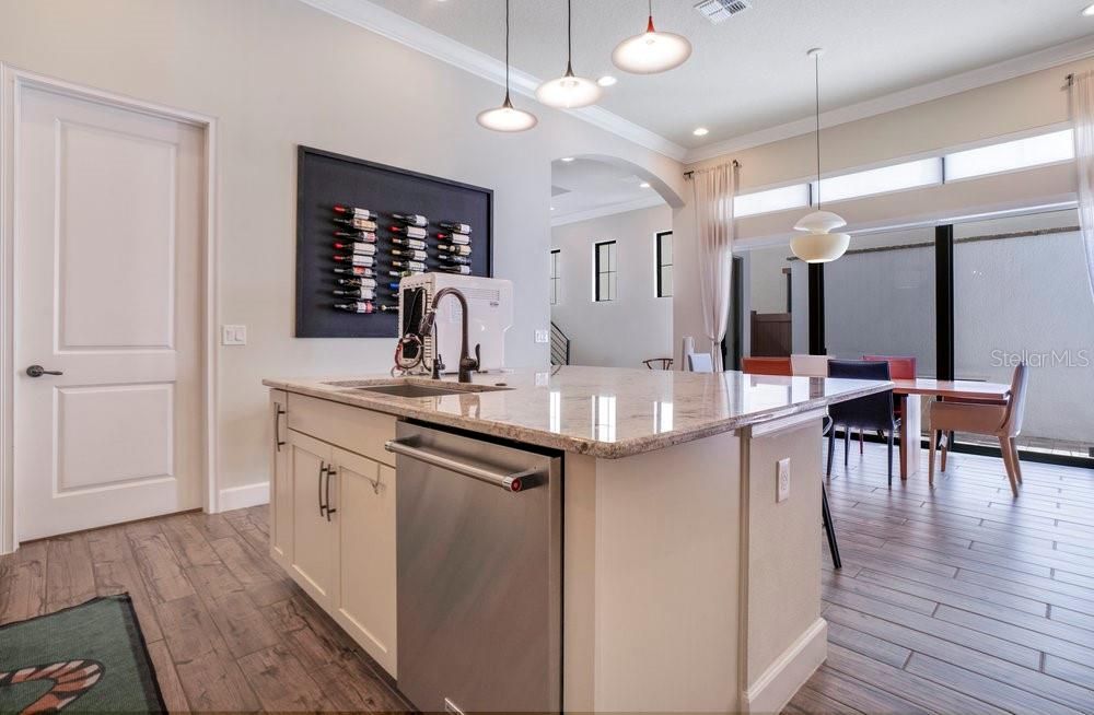 Dining room, Interior, Kitchen, Pendant Lights, Recessed Lighting, Stainless Steel Appliances, Wood Texture Flooring