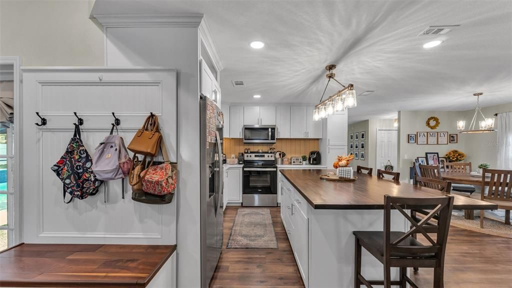 Dining room, Interior, Kitchen, Pendant Lights, Recessed Lighting, Stainless Steel Appliances, Wood Texture Flooring