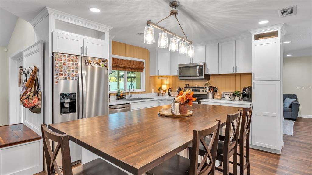 Dining room, Interior, Kitchen, Pendant Lights, Recessed Lighting, Stainless Steel Appliances, Wood Texture Flooring