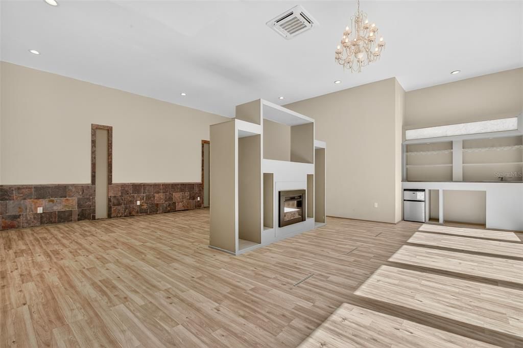Chandelier, Empty room, Fireplace, Interior, Recessed Lighting, Wood Texture Flooring