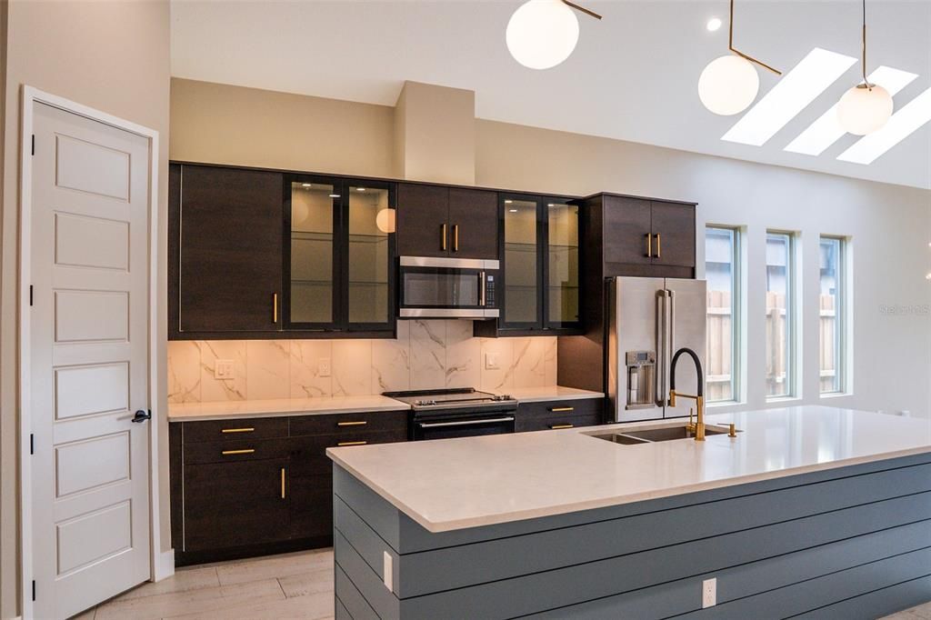 Interior, Kitchen, Marble Walls, Pendant Lights, Stainless Steel Appliances, Wood Texture Flooring