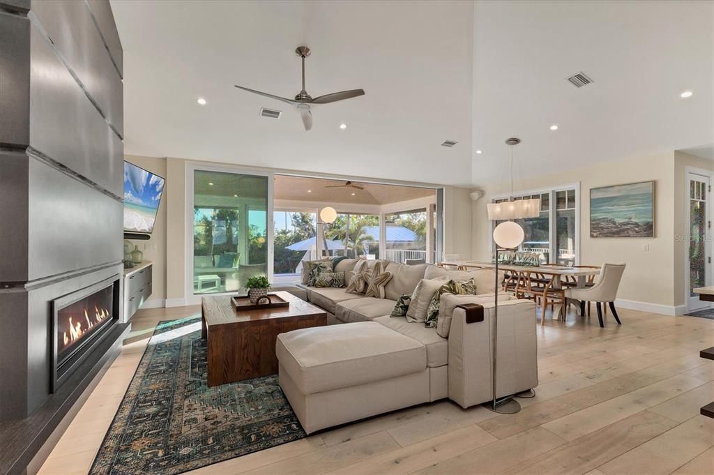 Dining room, Fireplace, Interior, Living room, Pendant Lights, Recessed Lighting, Wood Texture Flooring