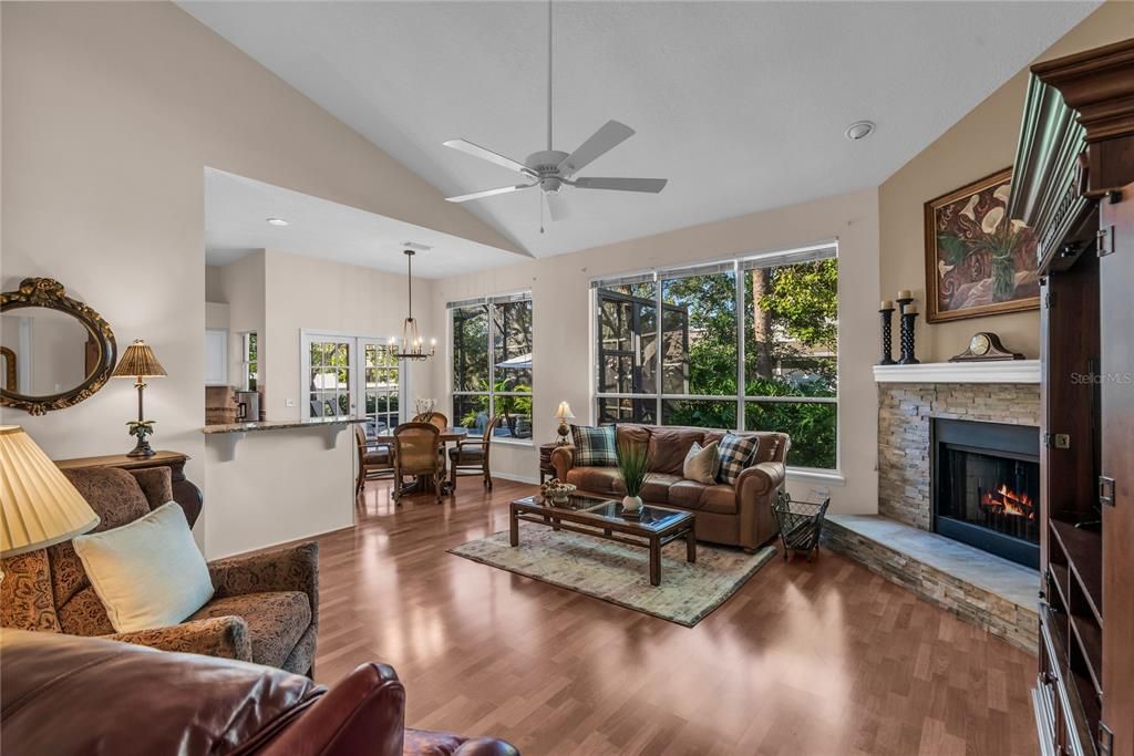 Dining room, Fireplace, Interior, Living room, Pendant Lights, Recessed Lighting, Wood Texture Flooring