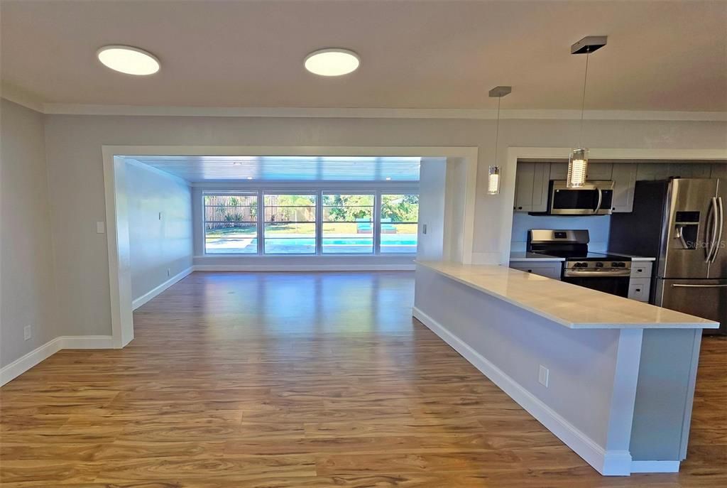 Interior, Kitchen, Pendant Lights, Recessed Lighting, Stainless Steel Appliances, Wood Texture Flooring