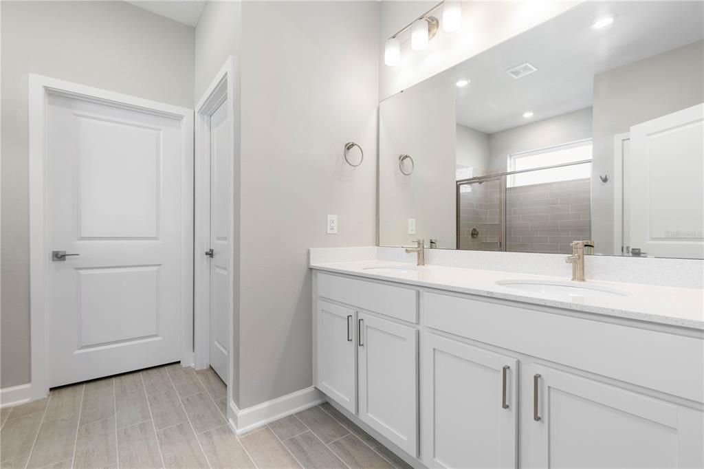 Bathroom, Dual Sink Vanities, Interior, Recessed Lighting, Wood Texture Flooring