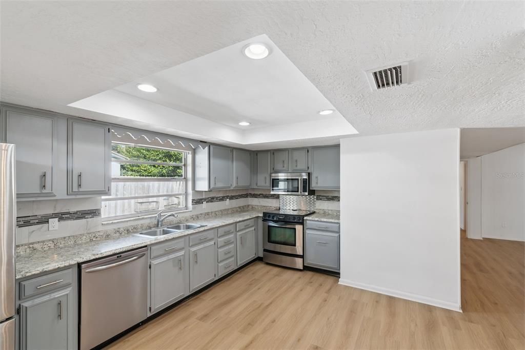 Interior, Kitchen, Recessed Lighting, Stainless Steel Appliances, Wood Texture Flooring