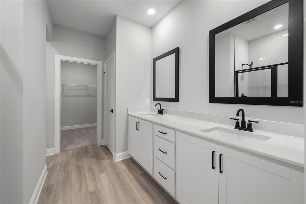 Bathroom, Dual Sink Vanities, Interior, Recessed Lighting, Walk-in Closets, Wood Texture Flooring