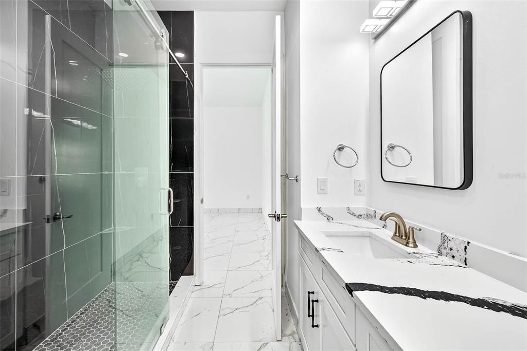Bathroom, Dual Sink Vanities, Glass Shower, Interior, Marble, Marble Walls