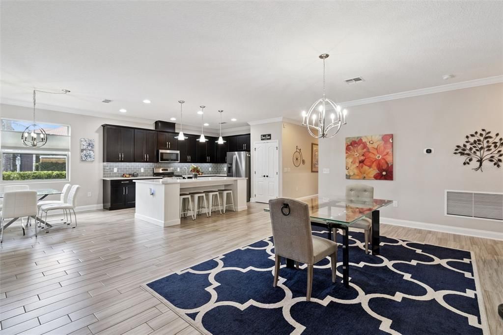 Chandelier, Dining room, Interior, Kitchen, Pendant Lights, Recessed Lighting, Stainless Steel Appliances, Wood Texture Flooring