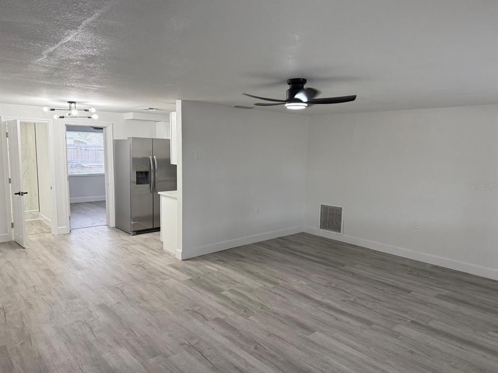 Empty room, Interior, Kitchen, Stainless Steel Appliances, Wood Texture Flooring