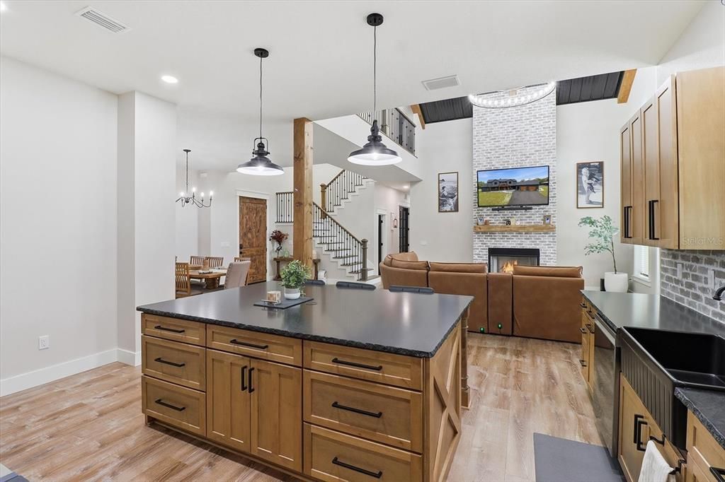 Dining room, Fireplace, Interior, Living room, Pendant Lights, Recessed Lighting, Wood Texture Flooring