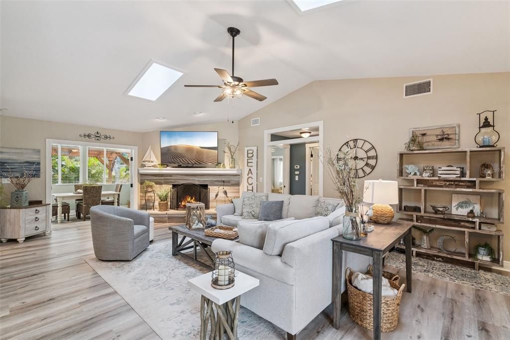 Dining room, Fireplace, Interior, Living room, Recessed Lighting, Wood Texture Flooring