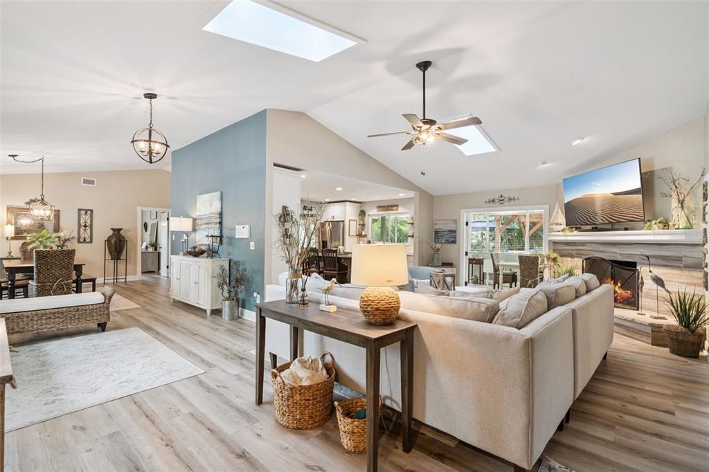 Dining room, Fireplace, Interior, Living room, Pendant Lights, Recessed Lighting, Wood Texture Flooring