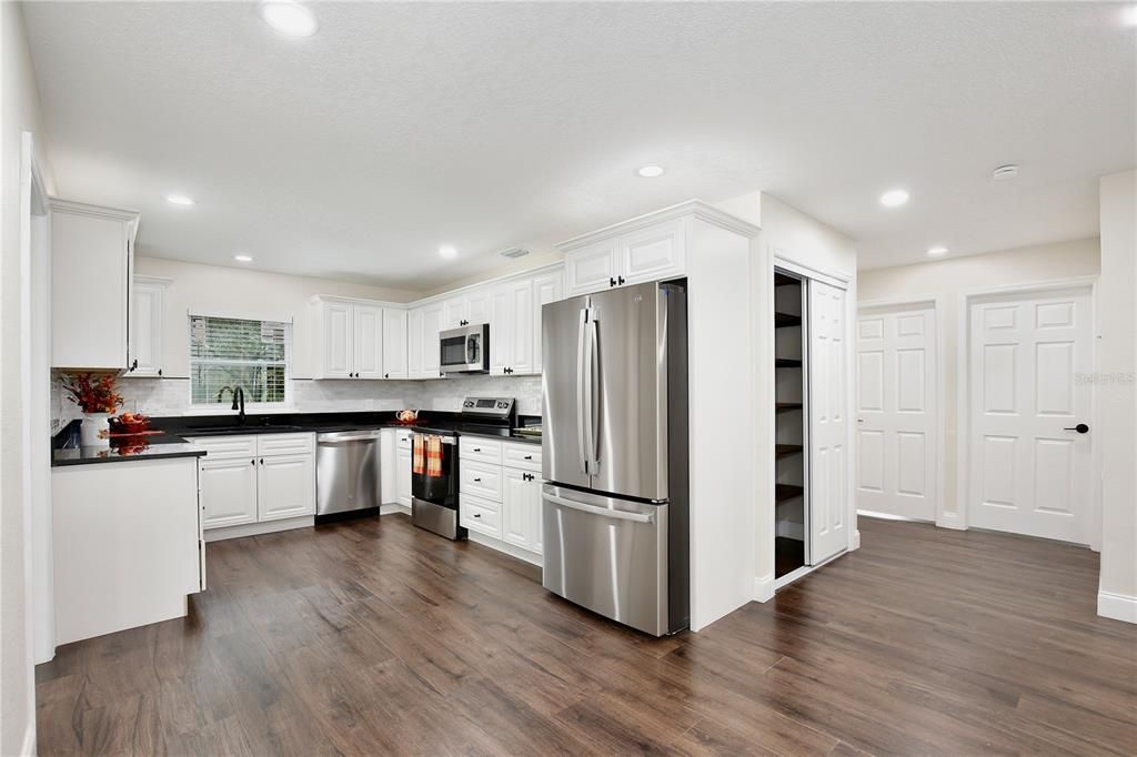 Interior, Kitchen, Recessed Lighting, Stainless Steel Appliances, Wood Texture Flooring