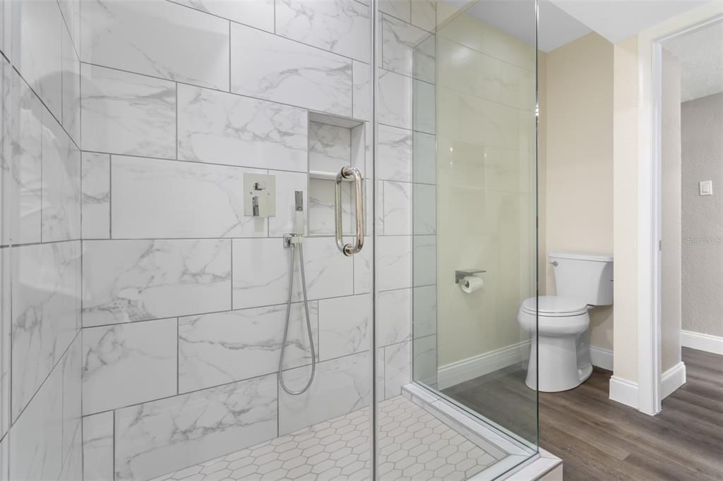 Bathroom, Glass Shower, Interior, Marble Walls, Wood Texture Flooring