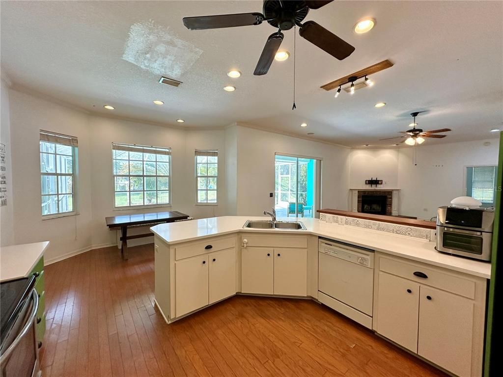 Fireplace, Interior, Kitchen, Recessed Lighting, Wood Texture Flooring