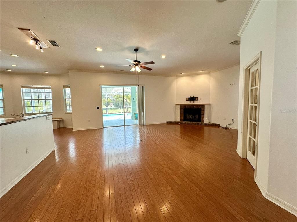Empty room, Fireplace, Interior, Recessed Lighting, Wood Texture Flooring