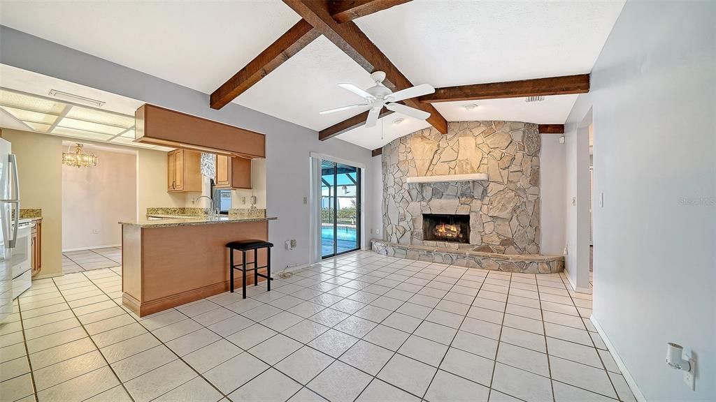 Chandelier, Empty room, Fireplace, Interior, Kitchen, Recessed Lighting, Stone Walls, Wooden Beams