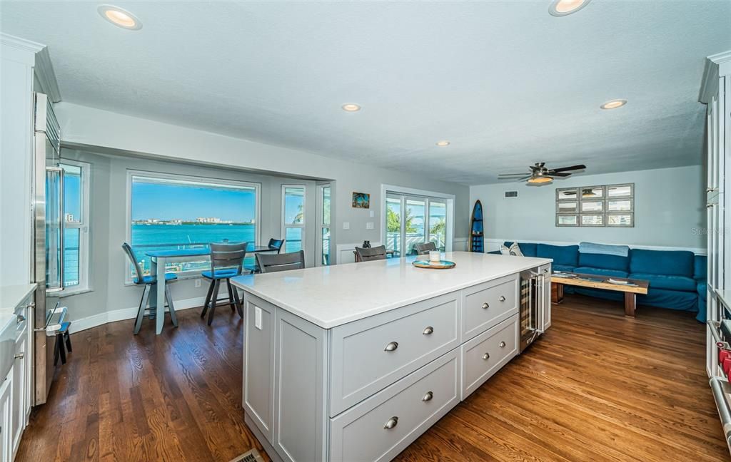 Dining room, Interior, Kitchen, Living room, Recessed Lighting, Water, Wood Texture Flooring