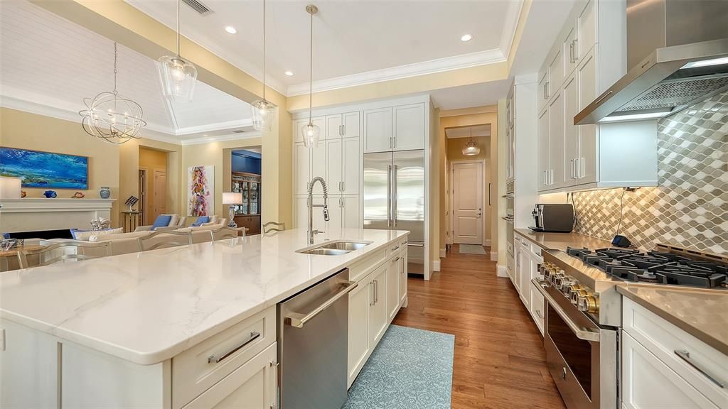 Chandelier, Interior, Kitchen, Living room, Pendant Lights, Recessed Lighting, Stainless Steel Appliances, Wood Texture Flooring