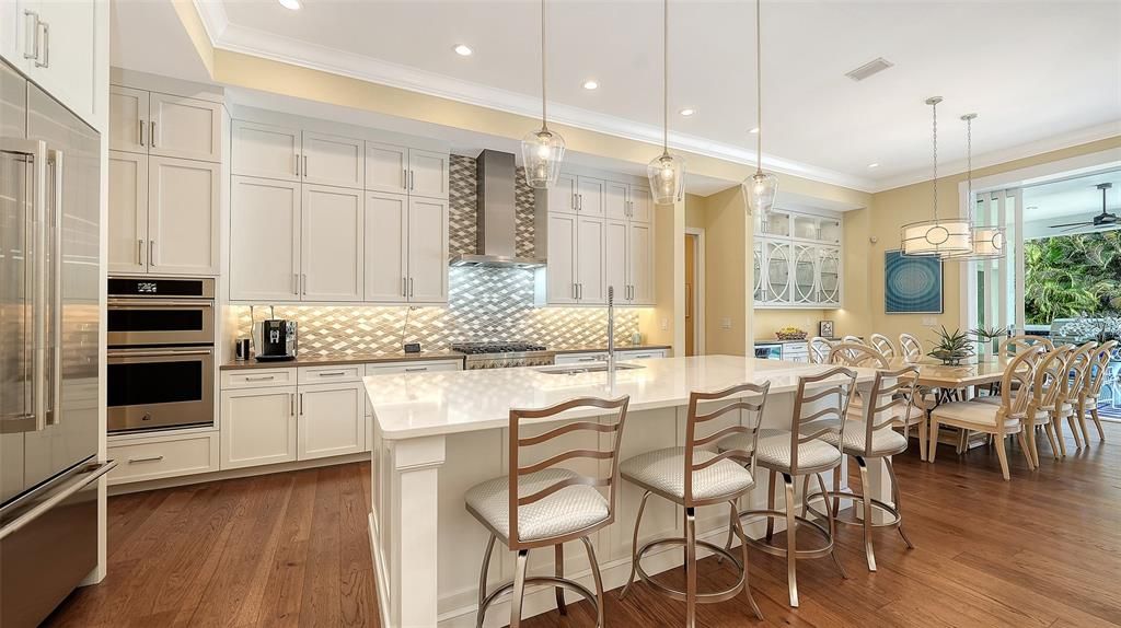 Dining room, Interior, Kitchen, Pendant Lights, Recessed Lighting, Stainless Steel Appliances, Wood Texture Flooring