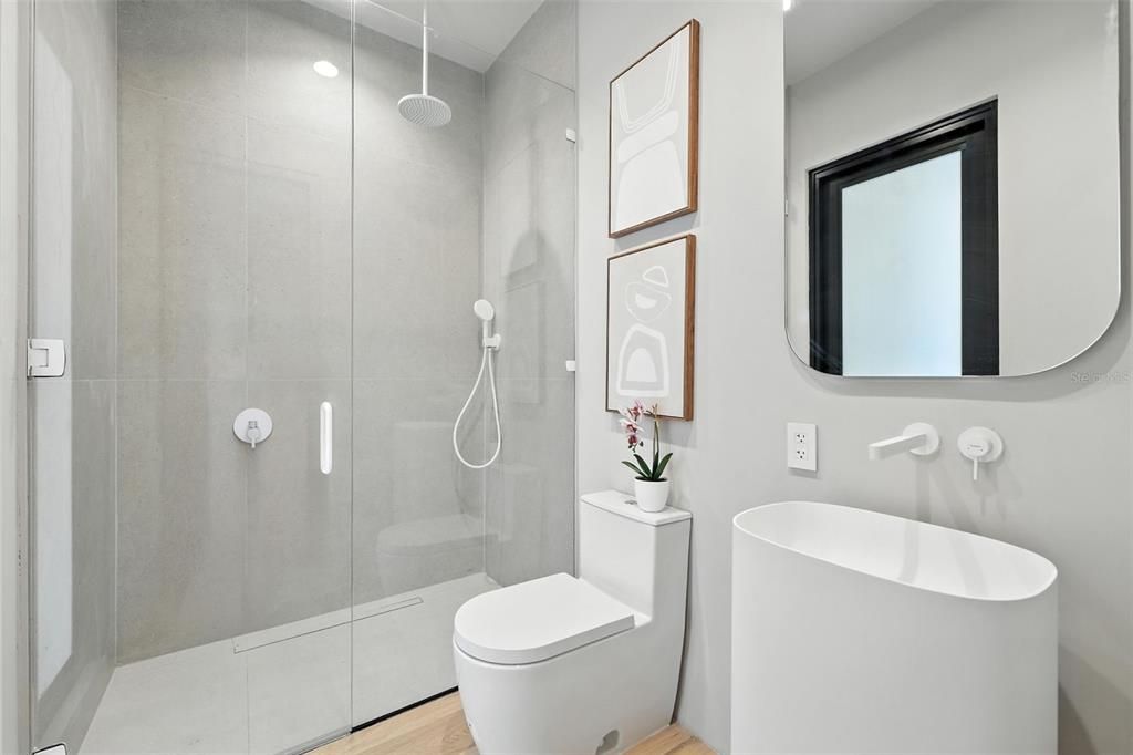 Bathroom, Free Standing Baths, Glass Shower, Interior, Recessed Lighting, Wood Texture Flooring