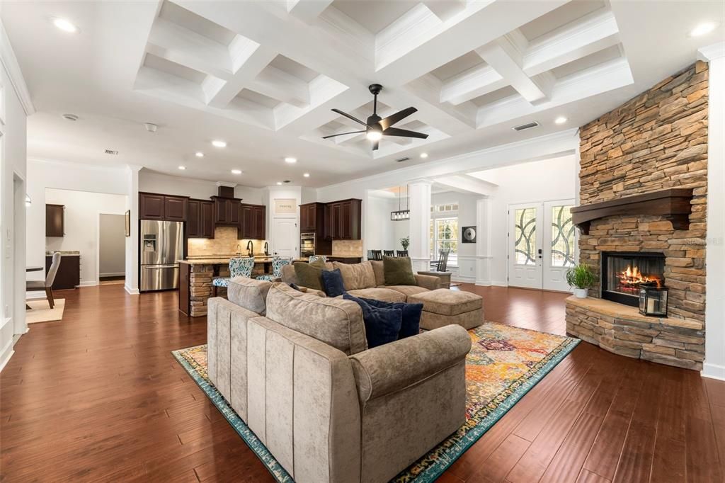 Fireplace, Interior, Kitchen, Living room, Recessed Lighting, Stainless Steel Appliances, Stone Walls, Wood Texture Flooring