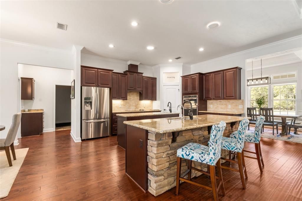 Dining room, Interior, Kitchen, Pendant Lights, Recessed Lighting, Stainless Steel Appliances, Wood Texture Flooring