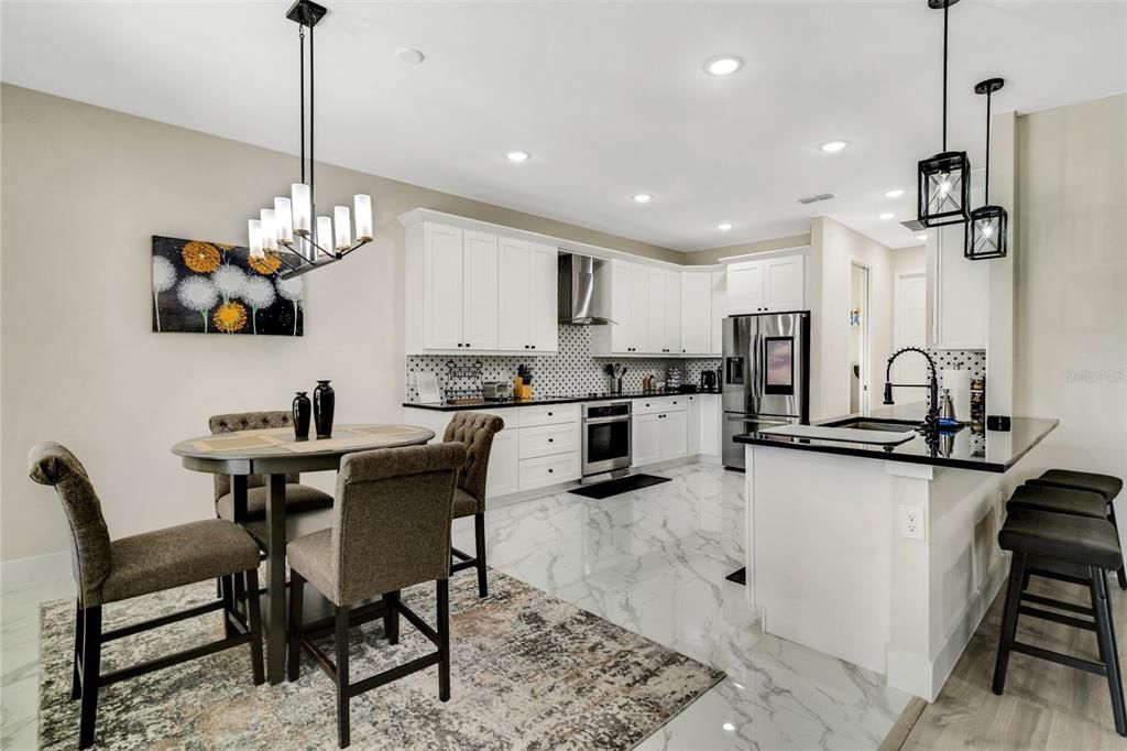 Chandelier, Dining room, Interior, Kitchen, Marble, Pendant Lights, Recessed Lighting, Stainless Steel Appliances