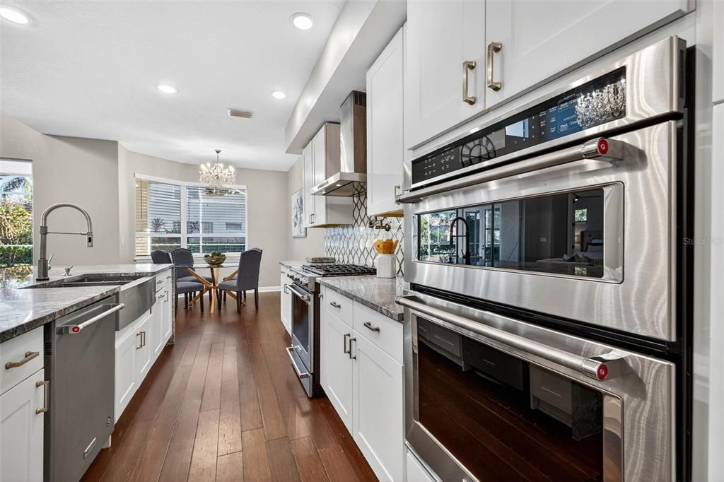 Chandelier, Dining room, Interior, Kitchen, Recessed Lighting, Stainless Steel Appliances, Wood Texture Flooring