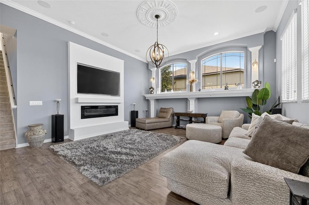 Chandelier, Fireplace, Interior, Living room, Pendant Lights, Recessed Lighting, Wood Texture Flooring