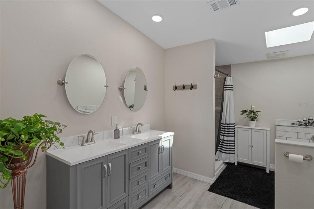 Bathroom, Dual Sink Vanities, Interior, Recessed Lighting, Wood Texture Flooring