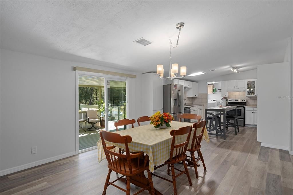 Chandelier, Dining room, Interior, Kitchen, Stainless Steel Appliances, Wood Texture Flooring